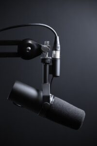 black and silver microphone with stand - how to start a podcast in 2023