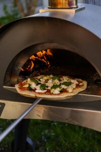 How To Build An Outdoor Kitchen - making pizza